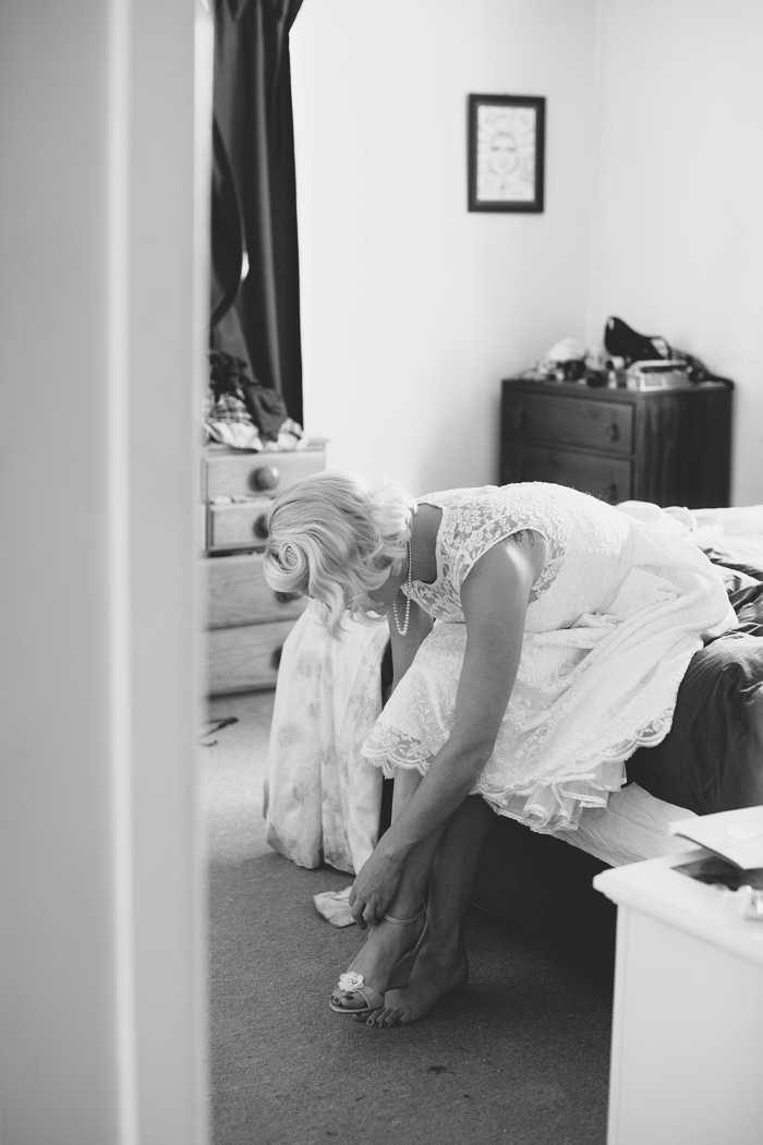 Bride Getting Ready - A Tea Length Wedding Dress for a Fabulously Relaxed, 1950s Inspired Wedding from Emily Raftery Photography
