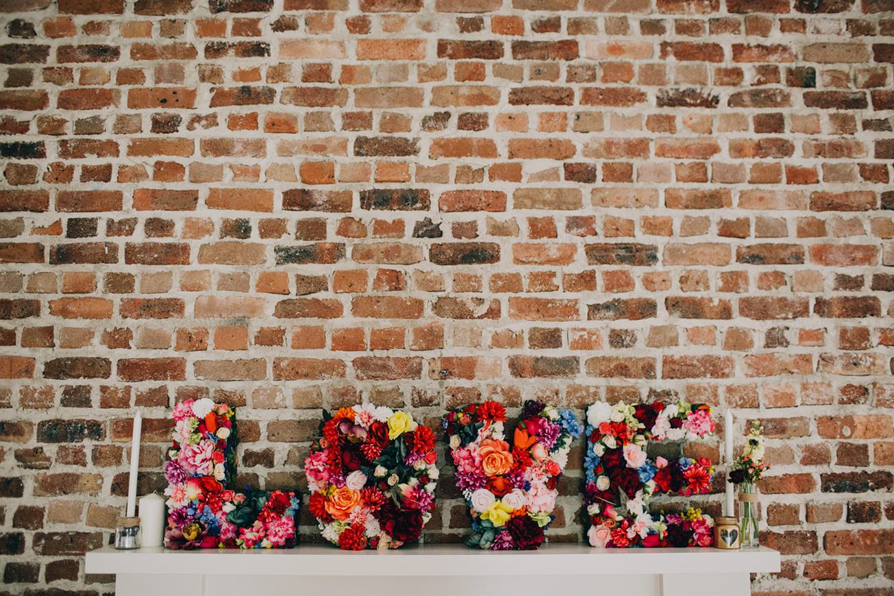Floral LOVE sign - A Super Stylish DIY Wedding Even the Rain Couldn't Ruin from John Benavente Photography