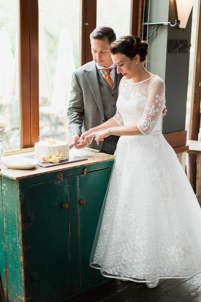 Vintage Bride & Groom Cutting the Cake - A Romantic & Intimate Wedding Full of Vintage Charm