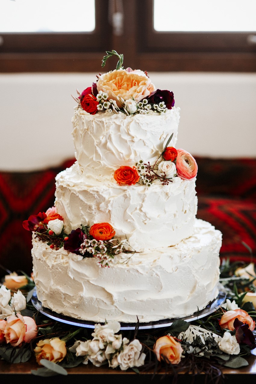 3 Tier Flower Adorned White Wedding Cake // Photography ~ Elizabeth Wells Photography