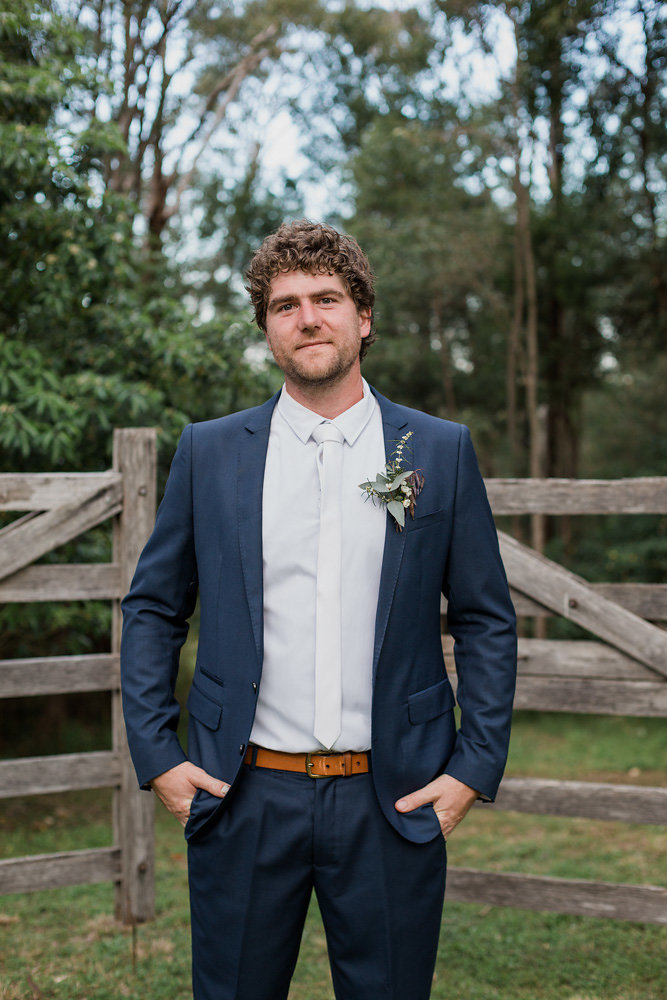 Relaxed Groom in a Navy Suit