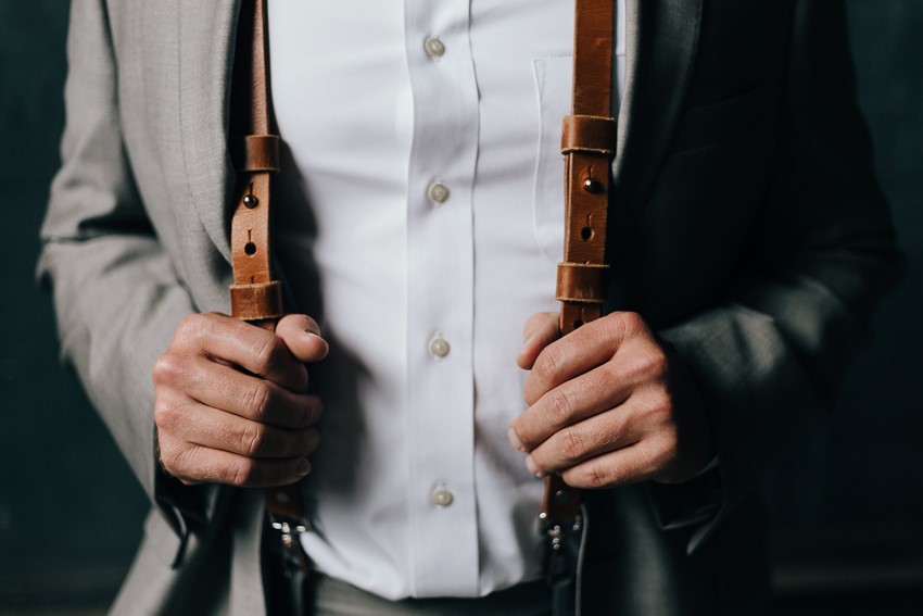 Groom Wearing Suspenders