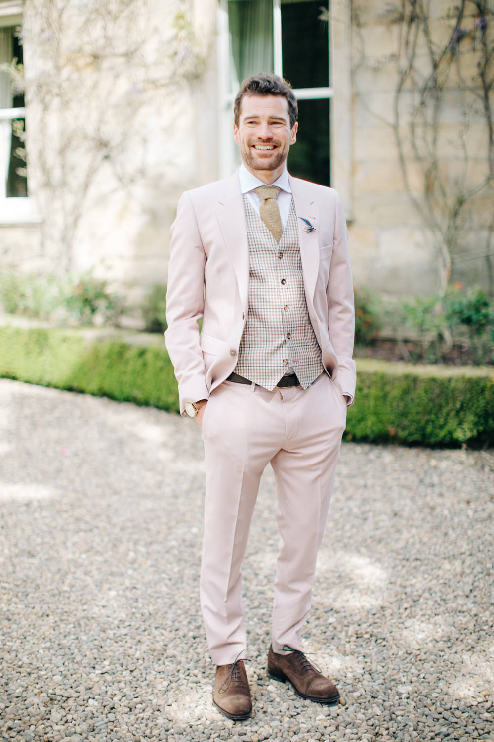 Groom in a Pale Pink Suit