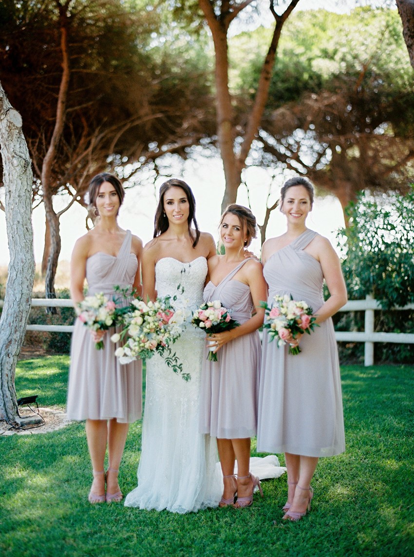 Bride & Pink Bridesmaids in Mid Length Dresses