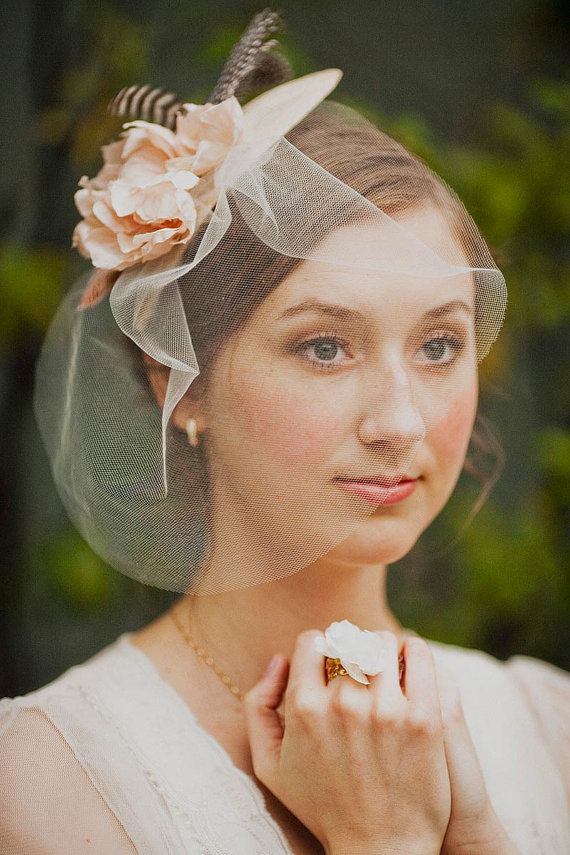 Hat fascinator with blush silk blossoms, guinea feathers and blusher veil from Mignonne Handmade