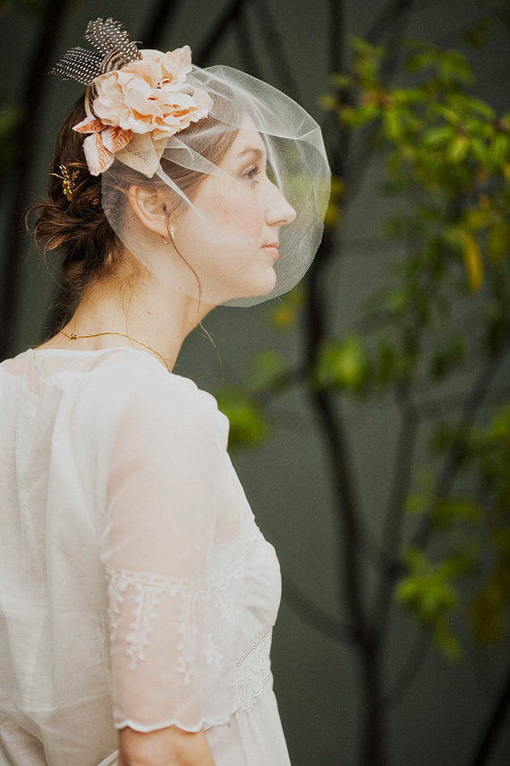 Hat fascinator with blush silk blossoms, guinea feathers and blusher veil