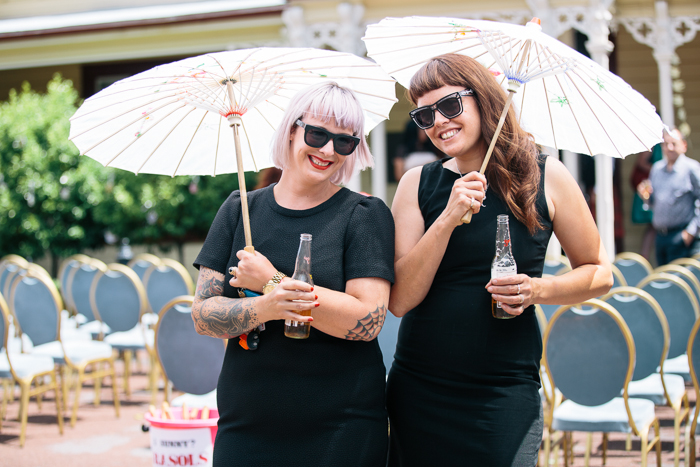 Guests with parasols - A Tea Length Wedding Dress for a Fabulously Relaxed, 1950s Inspired Wedding from Emily Raftery Photography