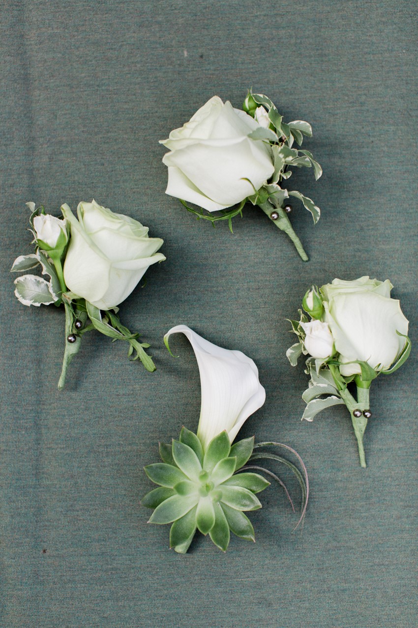 White Boutonnieres - A Vintage Inspired City Wedding in a Crisp and Elegant Palette of Ivory, Black & Green