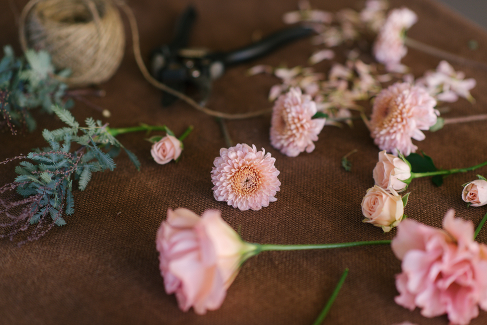 An Organic Hand-Tied Bridal Bouquet in Blush, Peach & Marsala