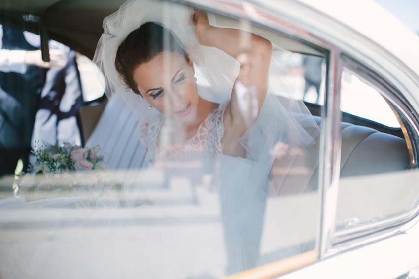 Bride Arriving in a Vintage Car 