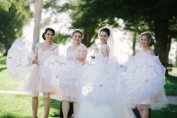 Bride & Bridesmaids with Parasols Photography by Claire Morgan