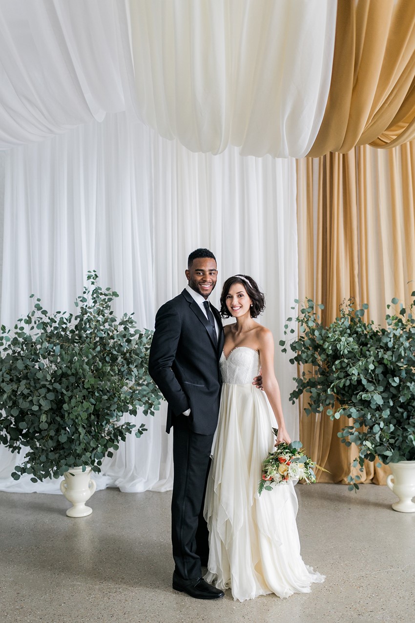 Bride & Groom before a backdrop of drapes// Photography ~ Alexis June Weddings