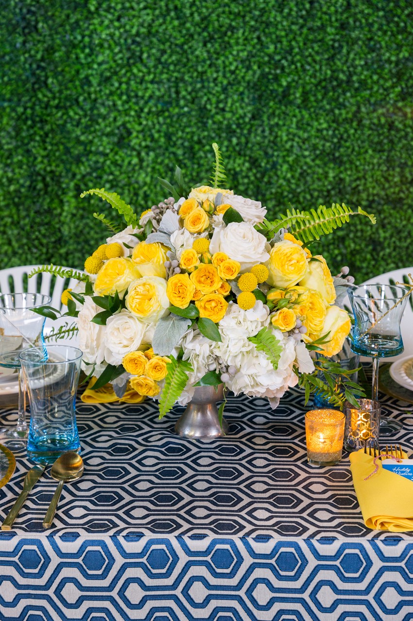 Yellow and white floral wedding centerpiece