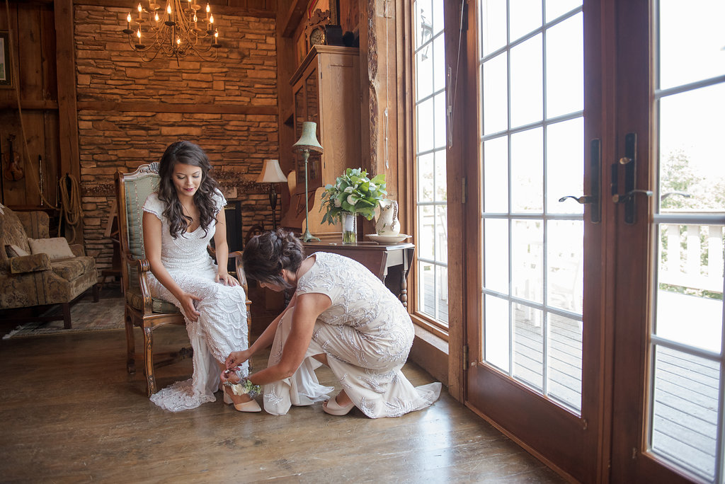 Bride Putting on Bridal Shoes